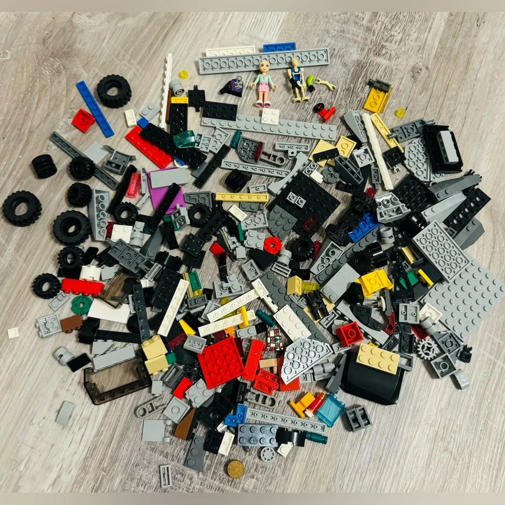 0.697 lbs. Net weight of small Lego bricks. Various parts and pieces. There are